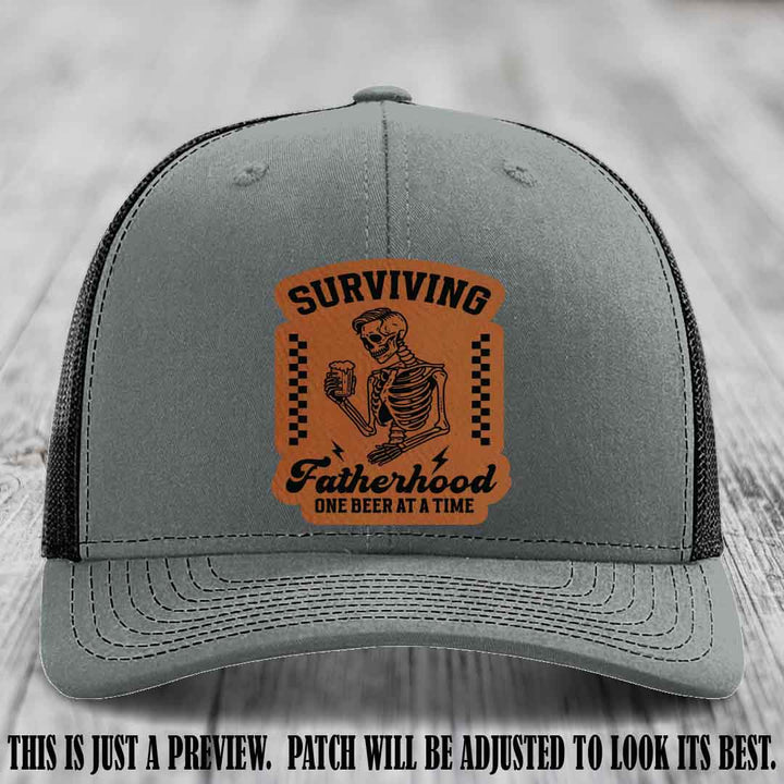 Surviving Fatherhood - Rawhide to Black Patch on Heather Grey to Black Hat, funny dad hat
