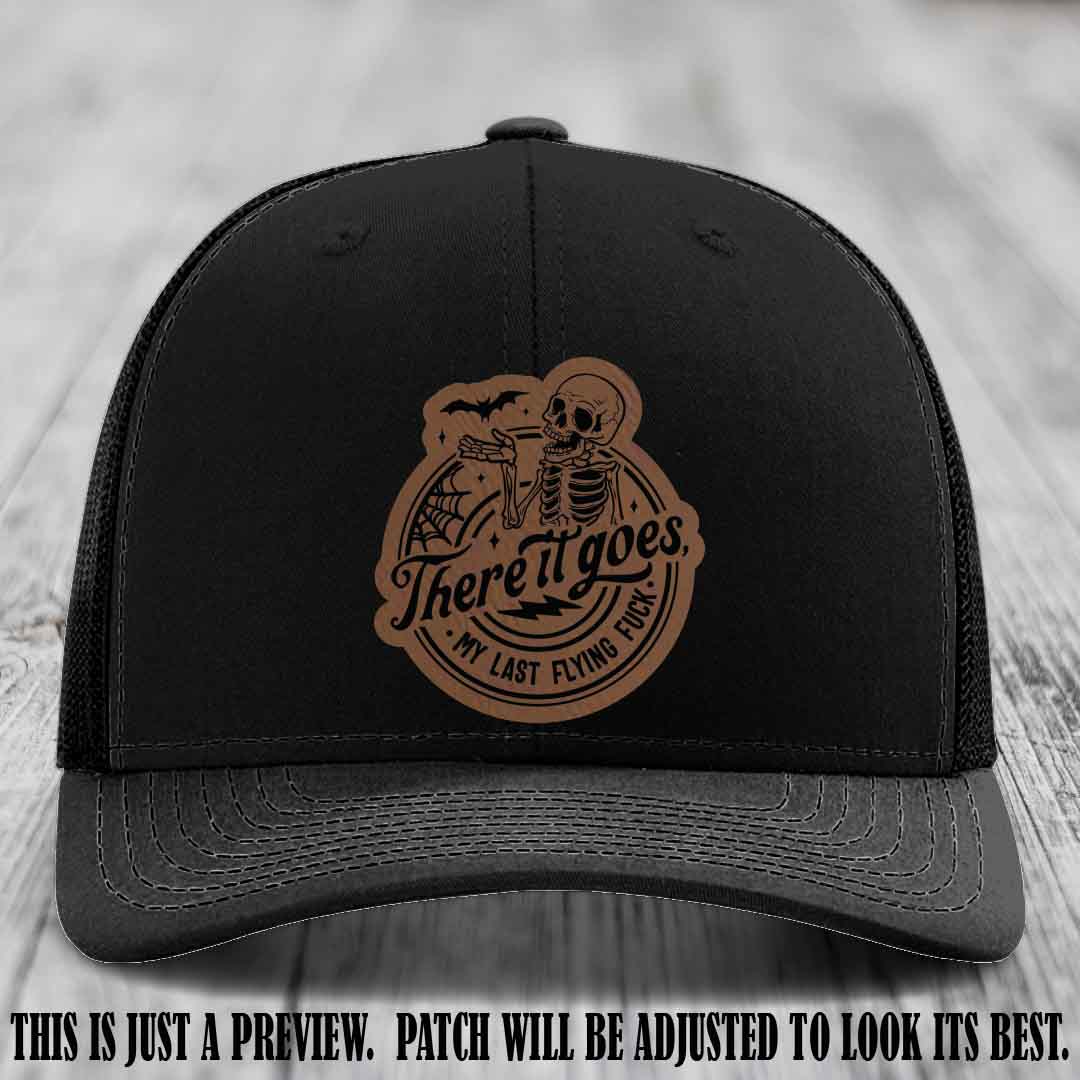 There It Goes design on Dark Brown to Black Patch, displayed on a Black Hat, funny Richardson 112 leather patch hat
