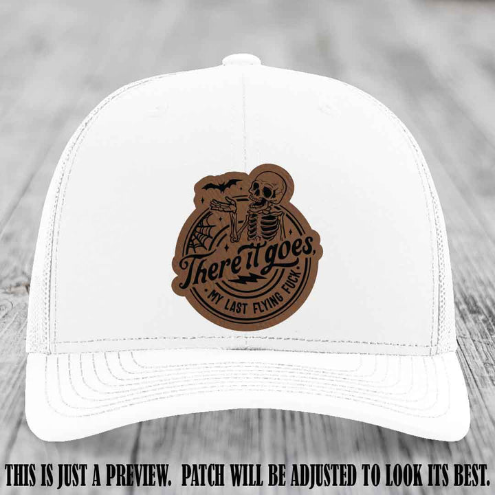 There It Goes design on Dark Brown to Black Patch, displayed on a White Hat, funny Richardson 112 leather patch hat