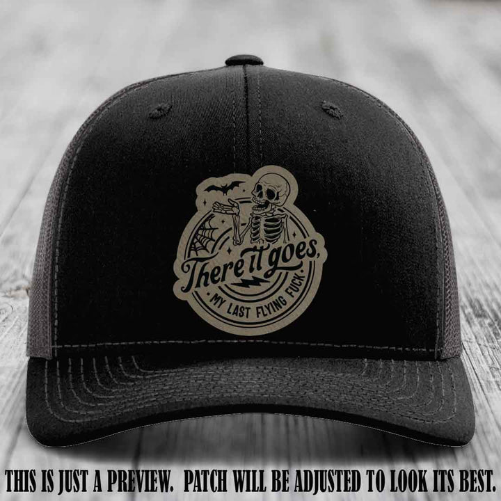 There It Goes design on Light Brown to Black Patch, displayed on a Black to Charcoal Hat, funny Richardson 112 leather patch hat