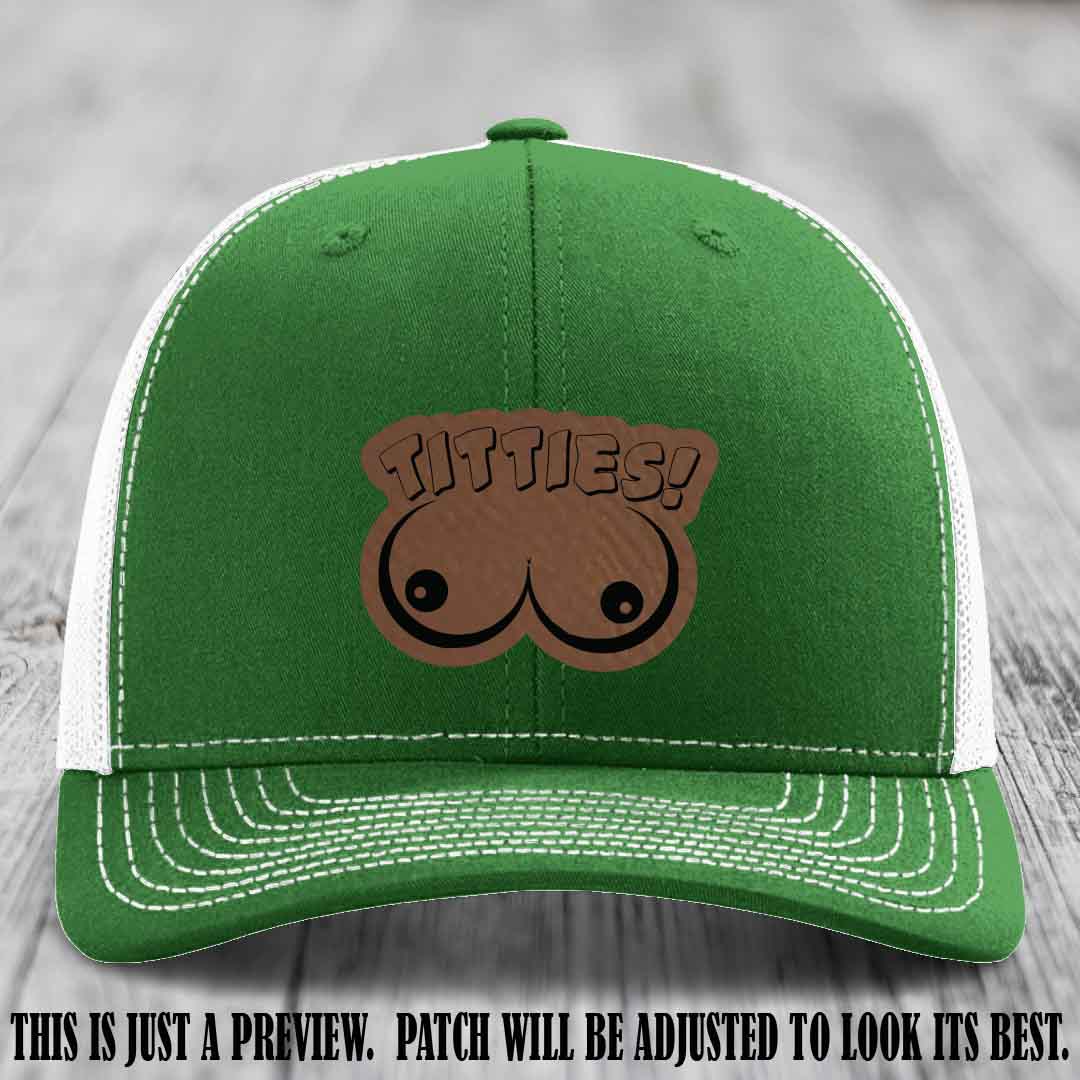 TITTIES! leather patch on Dark Brown to Black Patch mounted on a Kelly to White Hat – Richardson 112 funny trucker hat