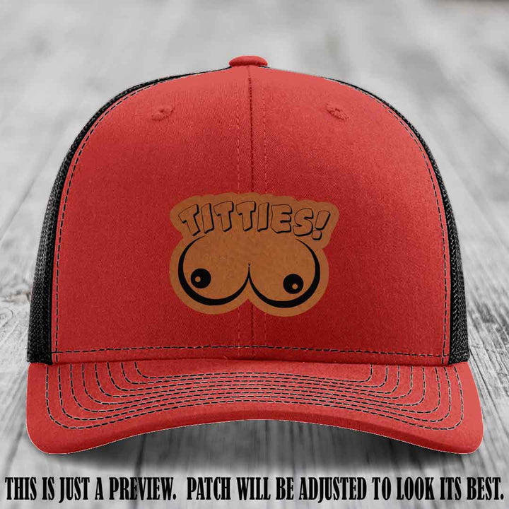 TITTIES! leather patch on Rawhide to Black Patch mounted on a Red to Black Hat β Richardson 112 funny trucker hat