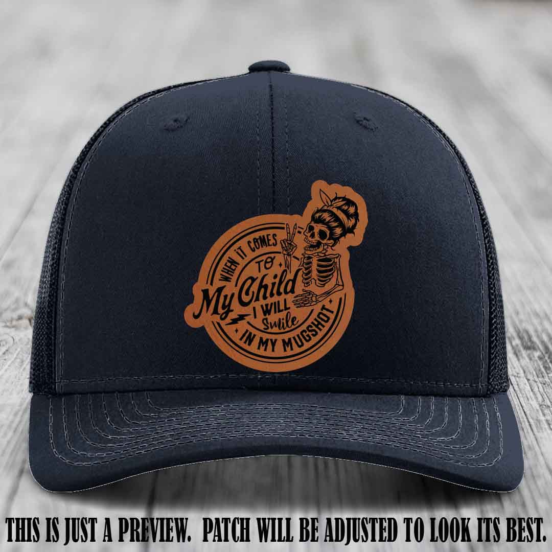 Richardson 112 custom trucker hat with rawhide to black patch and 'My Child Mugshot' leather patch on navy hat