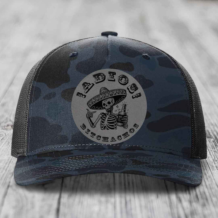 Camouflage trucker hat with skeleton graphic and &