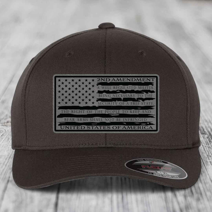 Dark brown Flexfit hat with 2nd Amendment leather patch featuring American flag design and text.