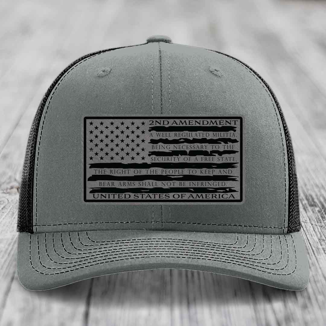 Grey trucker hat with black 2nd Amendment patch featuring American flag design and text.