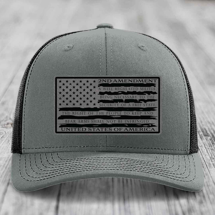 Grey trucker hat with black 2nd Amendment patch featuring American flag design and text.