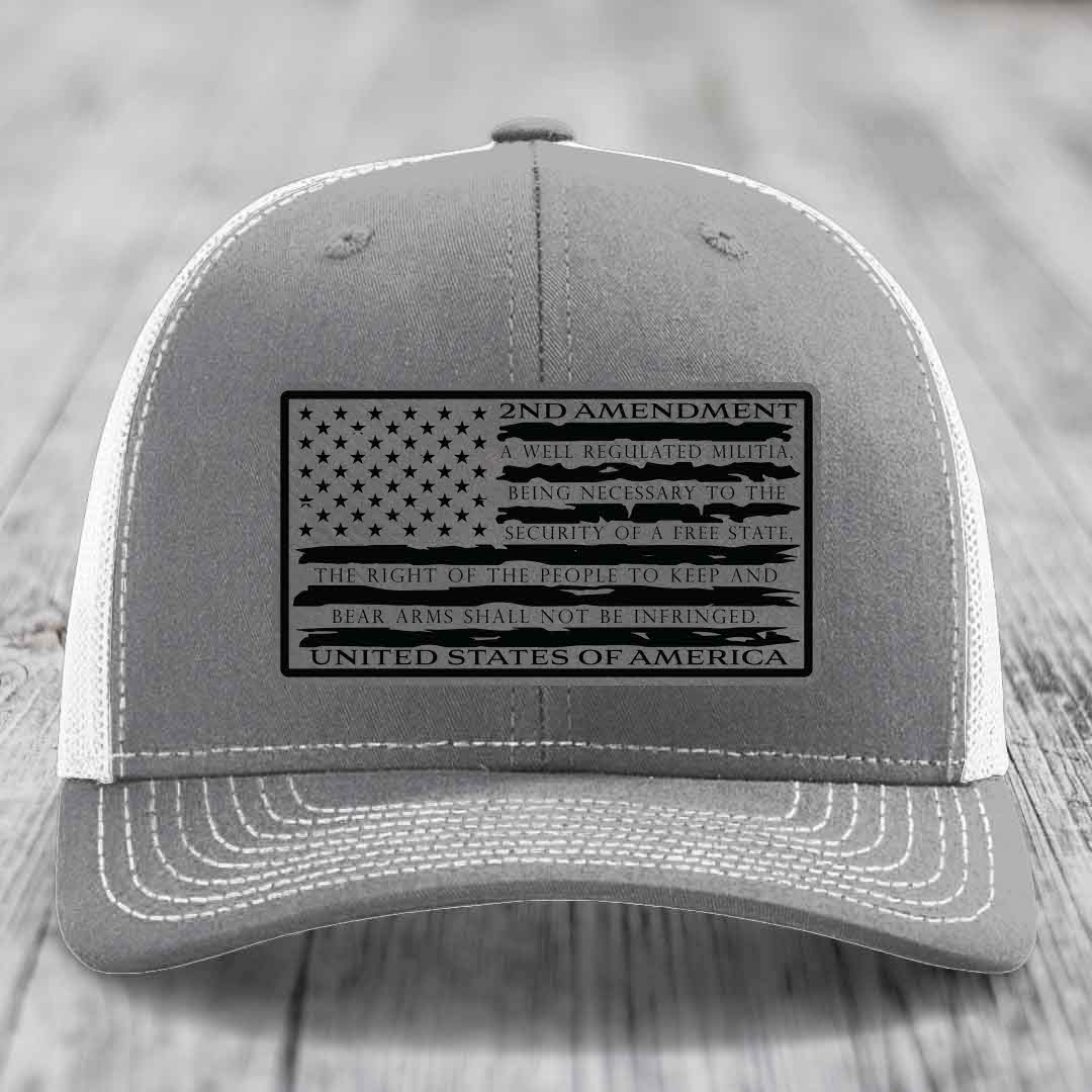 Grey trucker hat with black 2nd Amendment patch featuring American flag design and text.