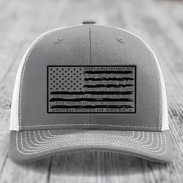 Grey trucker hat with black 2nd Amendment patch featuring American flag design and text.