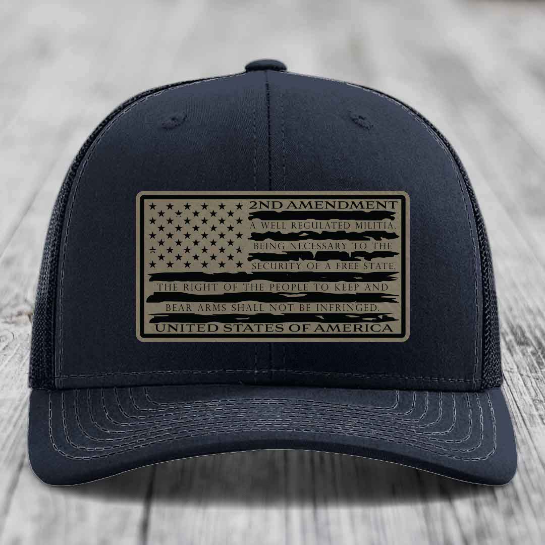 Black trucker hat with a rectangular patch featuring the American flag and 2nd Amendment text.