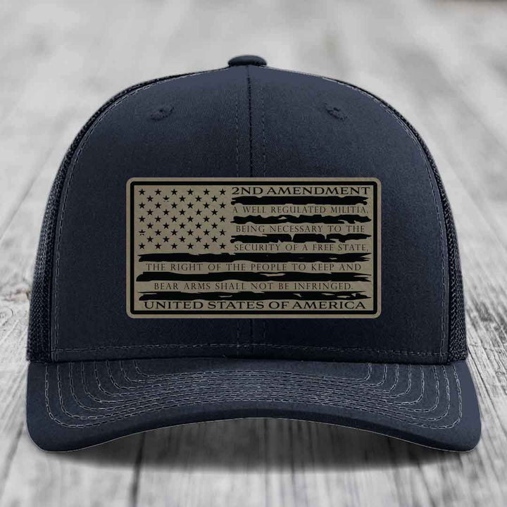Black trucker hat with a rectangular patch featuring the American flag and 2nd Amendment text.