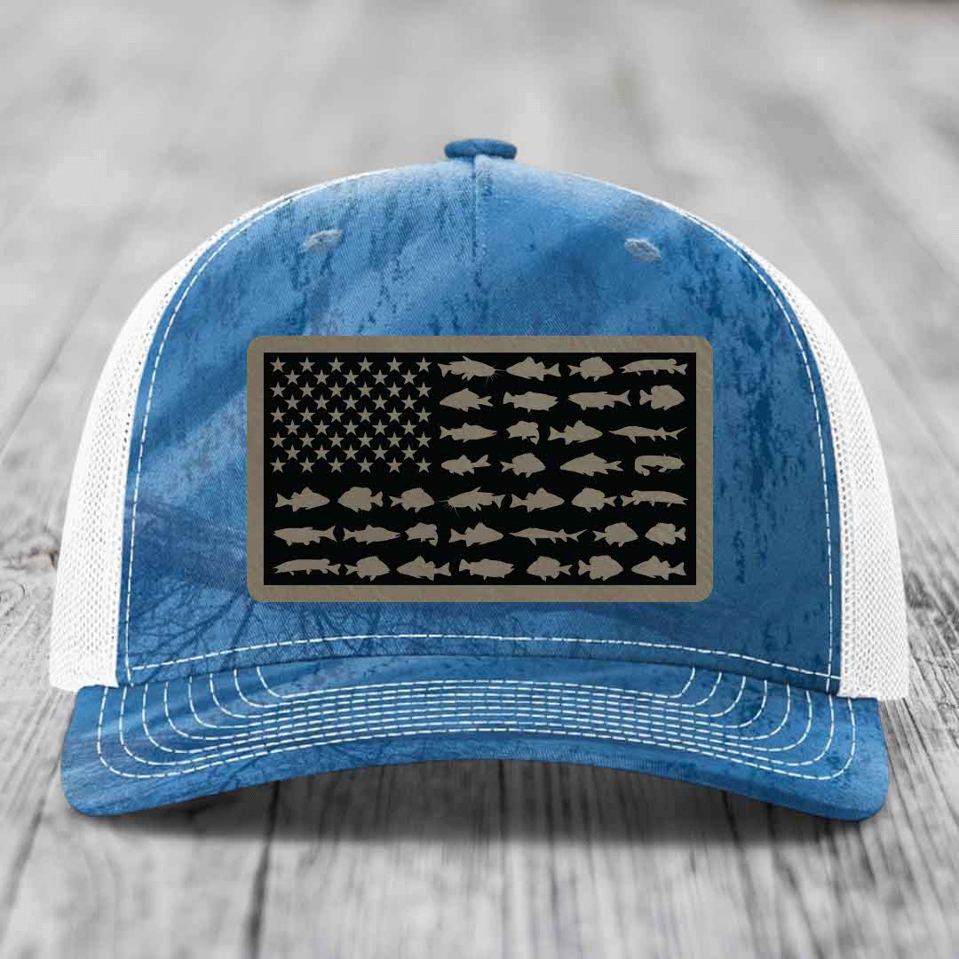 Blue and white trucker hat with American flag patch featuring fish silhouettes instead of stars and stripes.