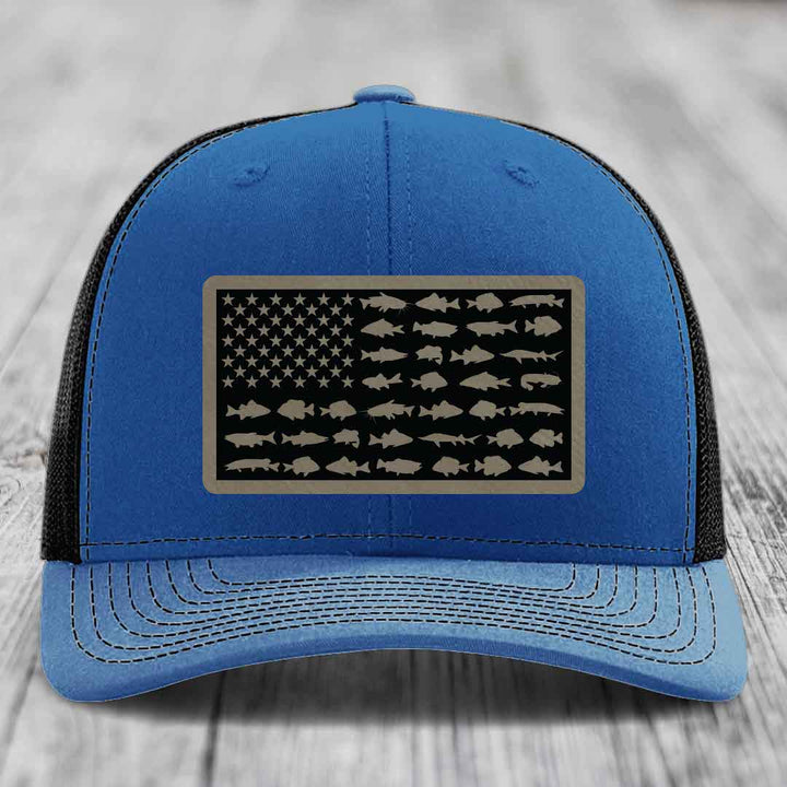 Blue trucker hat with American flag patch made of fish silhouettes.