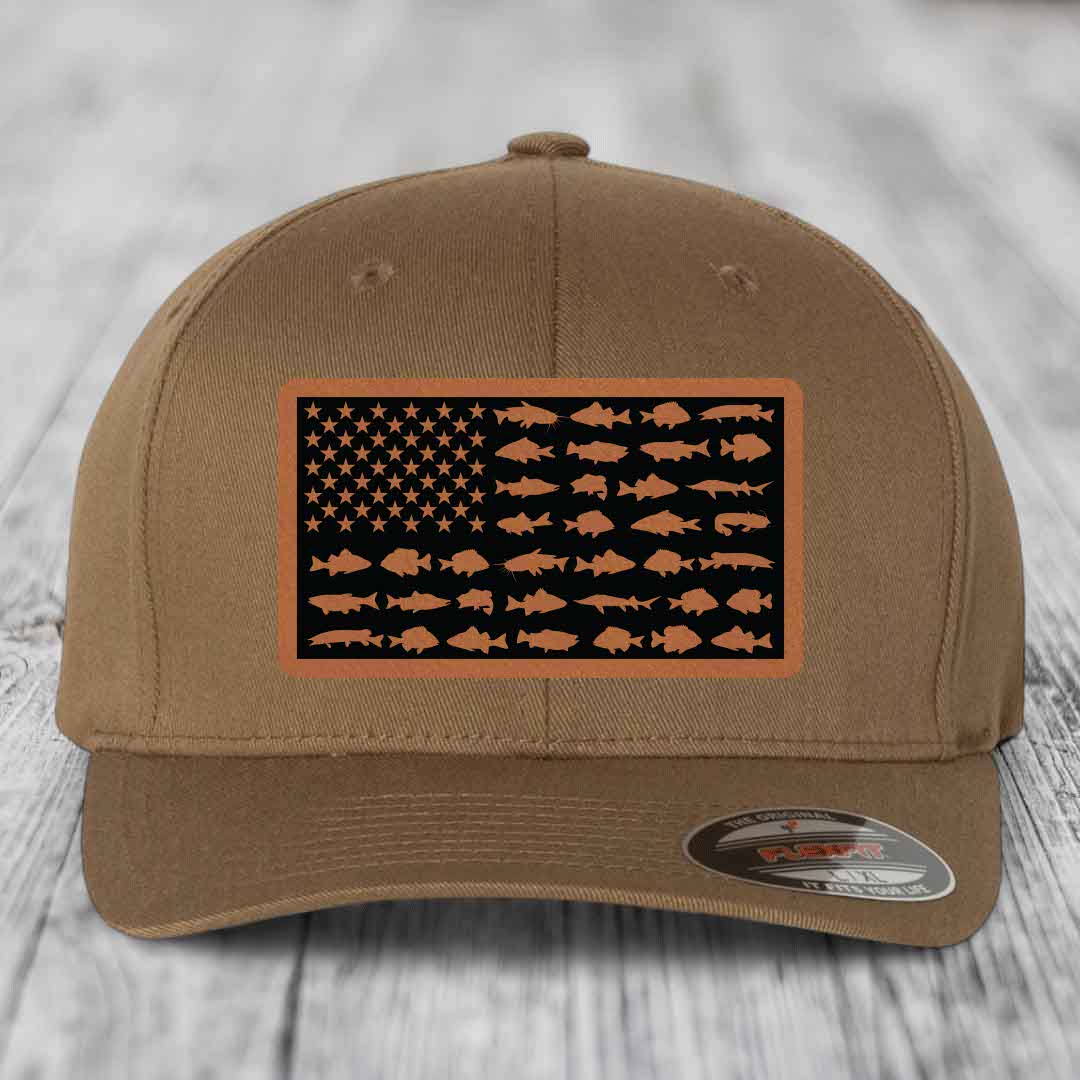 Tan baseball cap with American flag patch featuring fish silhouettes instead of stars and stripes.