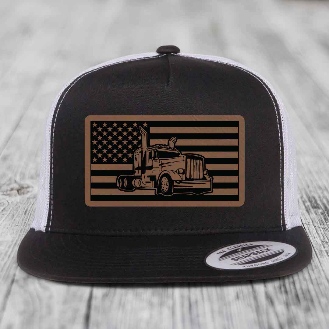 Black and white trucker hat with American flag patch featuring Peterbilt truck design.