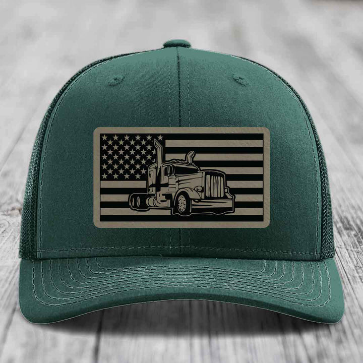 Green trucker hat with American flag patch featuring a Peterbilt truck illustration.