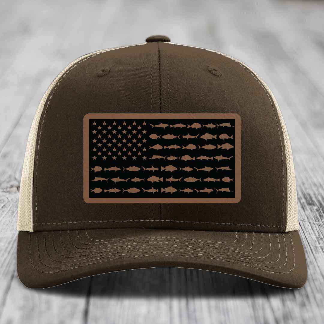 Brown trucker hat with American flag patch made of fish silhouettes.