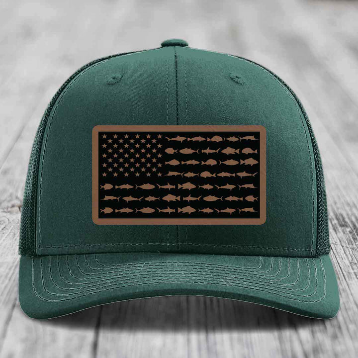 Green trucker hat with American flag patch featuring fish silhouettes instead of stars and stripes.