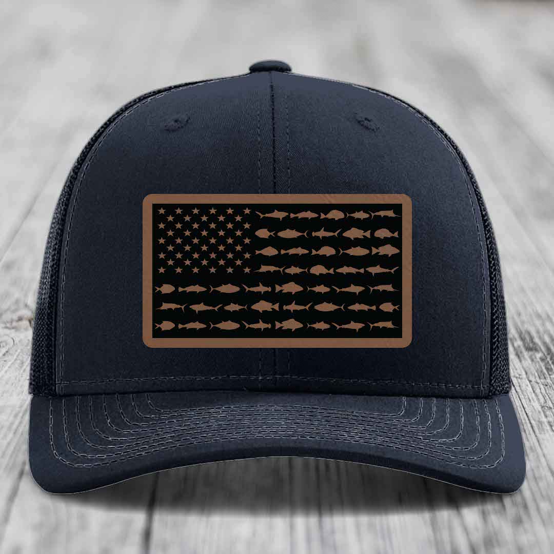 Black trucker hat with a rectangular patch featuring an American flag design made of saltwater fish silhouettes.