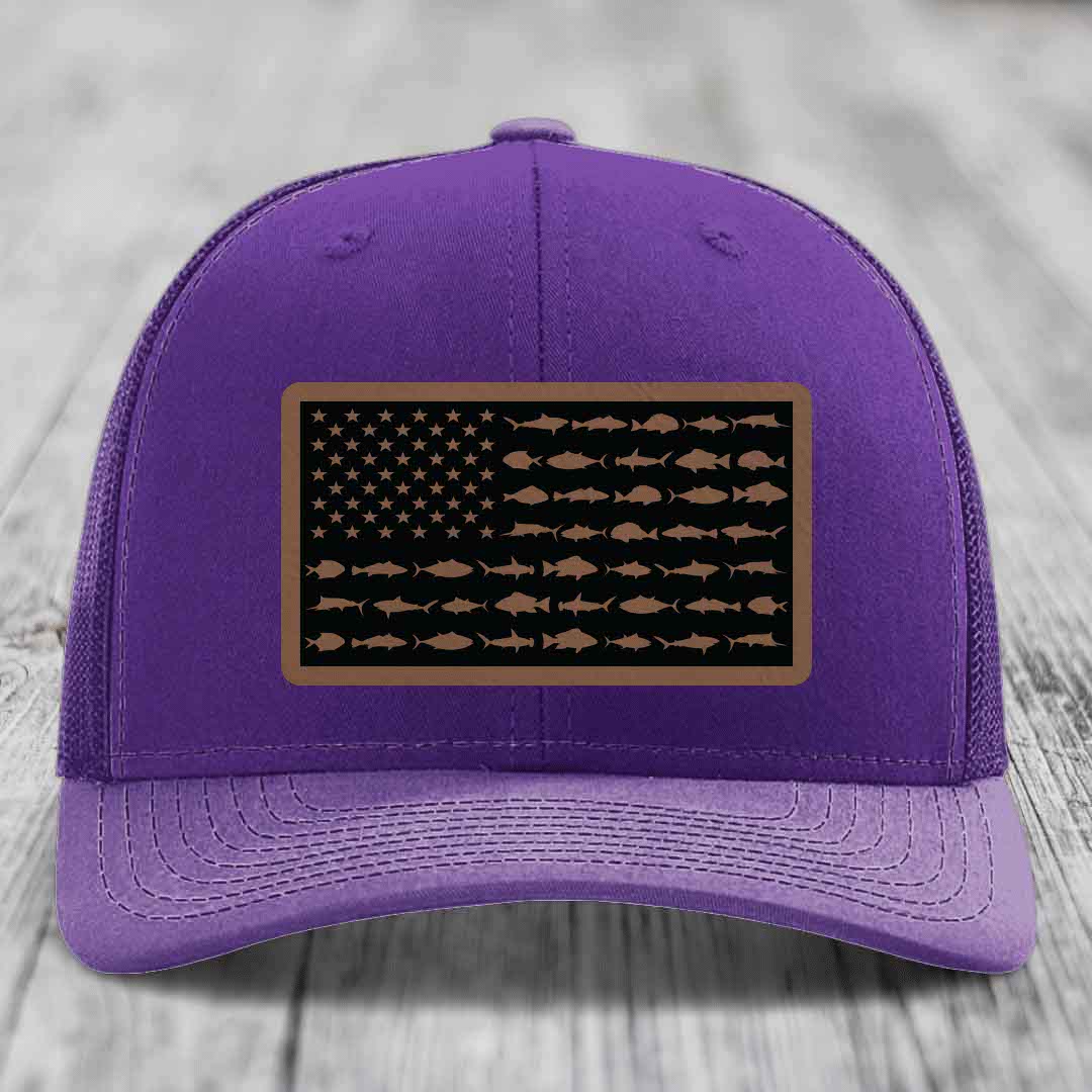 Purple trucker hat with a rectangular patch featuring an American flag design made of saltwater fish silhouettes.