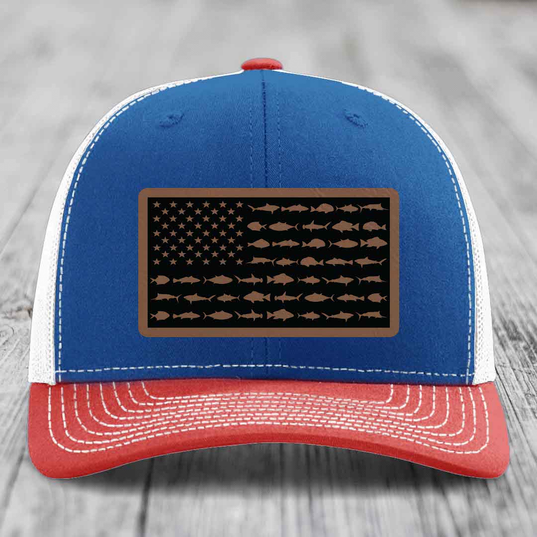 Blue and red trucker hat with American flag patch made of fish silhouettes.