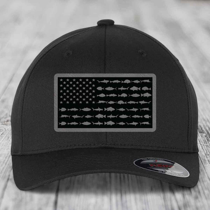 Black baseball cap with American flag patch made of saltwater fish silhouettes.