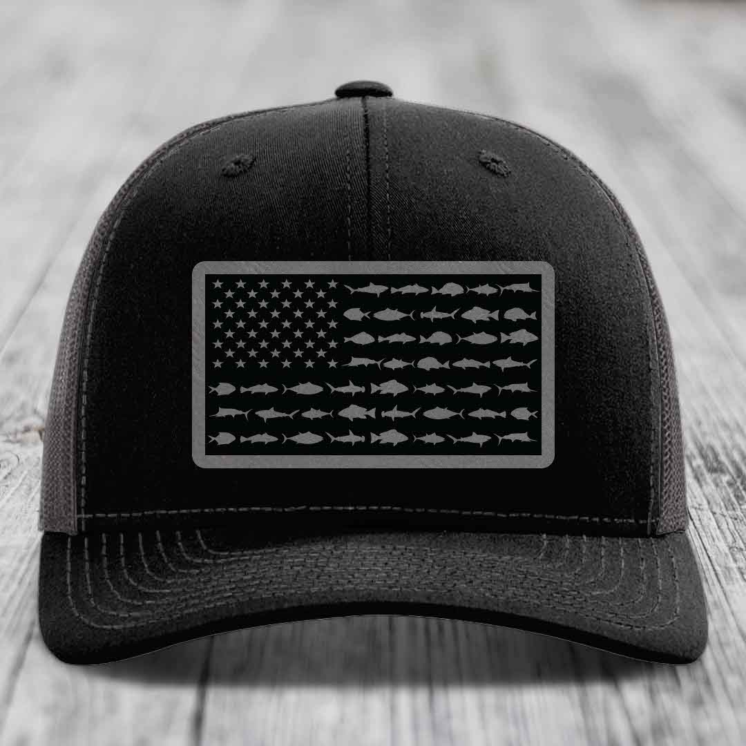Black trucker hat with American flag patch made of saltwater fish silhouettes.