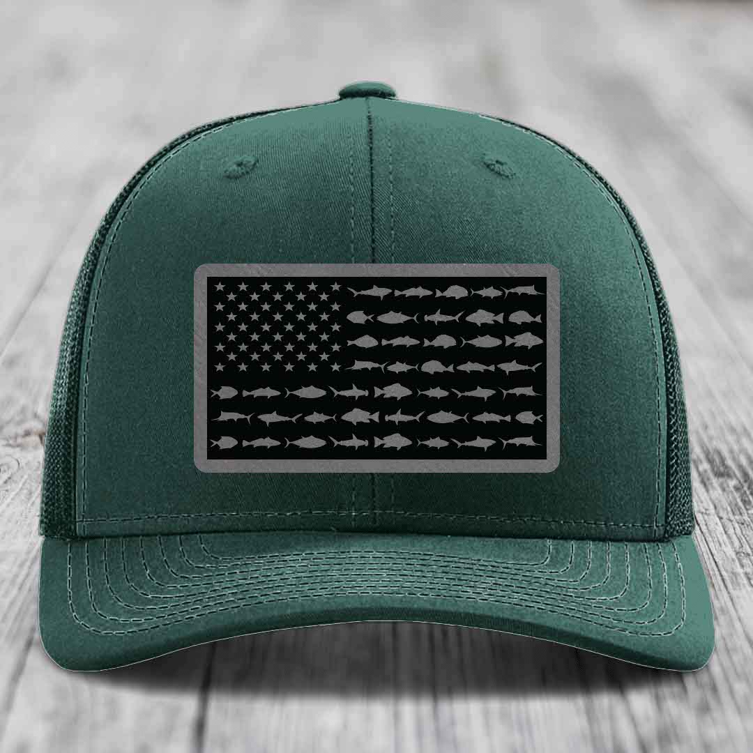 Green trucker hat with American flag patch made of saltwater fish silhouettes.