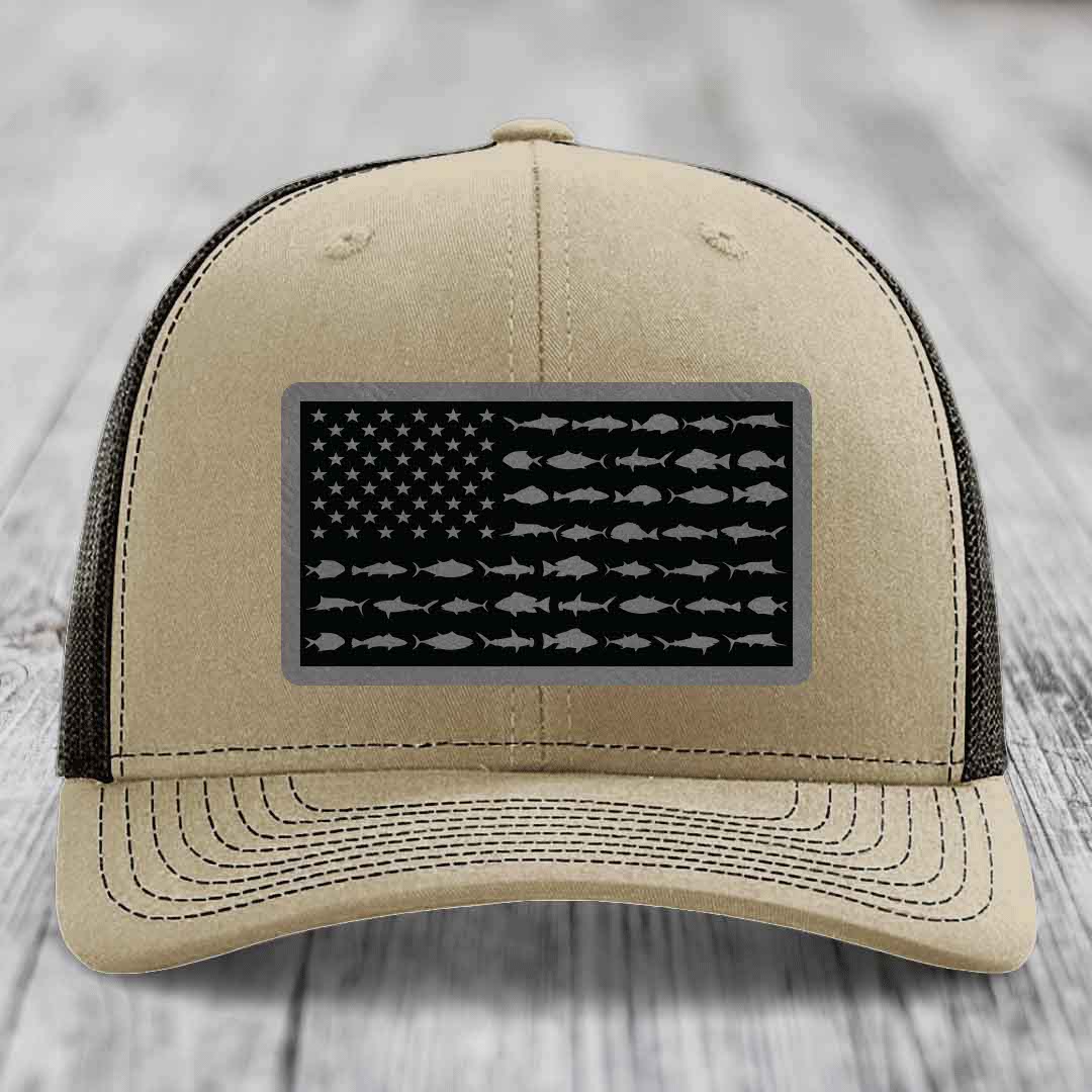 Beige trucker hat with black mesh back, featuring a rectangular patch of an American flag made of fish silhouettes.
