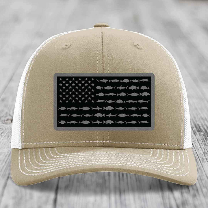 Tan trucker hat with American flag patch made of saltwater fish silhouettes.