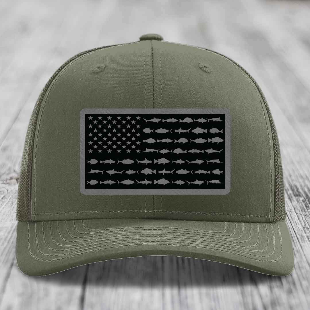 Olive green trucker hat with American flag patch featuring saltwater fish silhouettes instead of stars and stripes.
