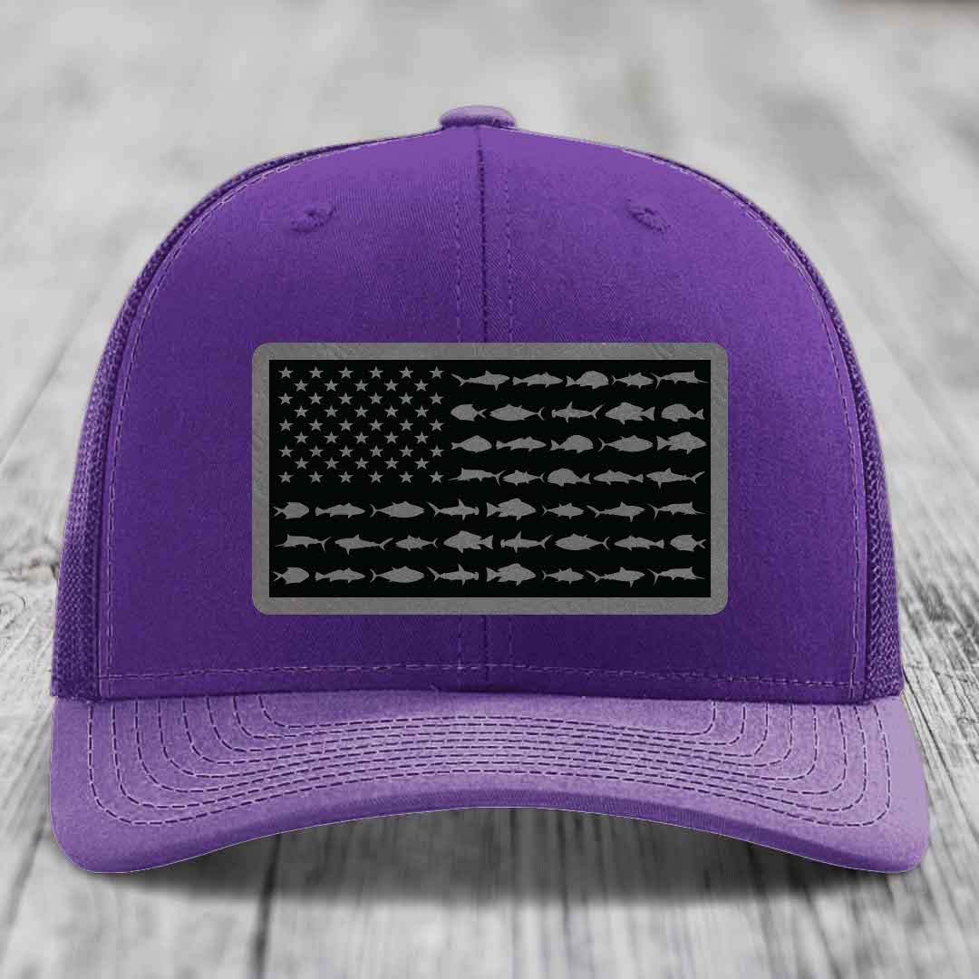 Purple trucker hat with American flag patch featuring fish silhouettes instead of stars and stripes.