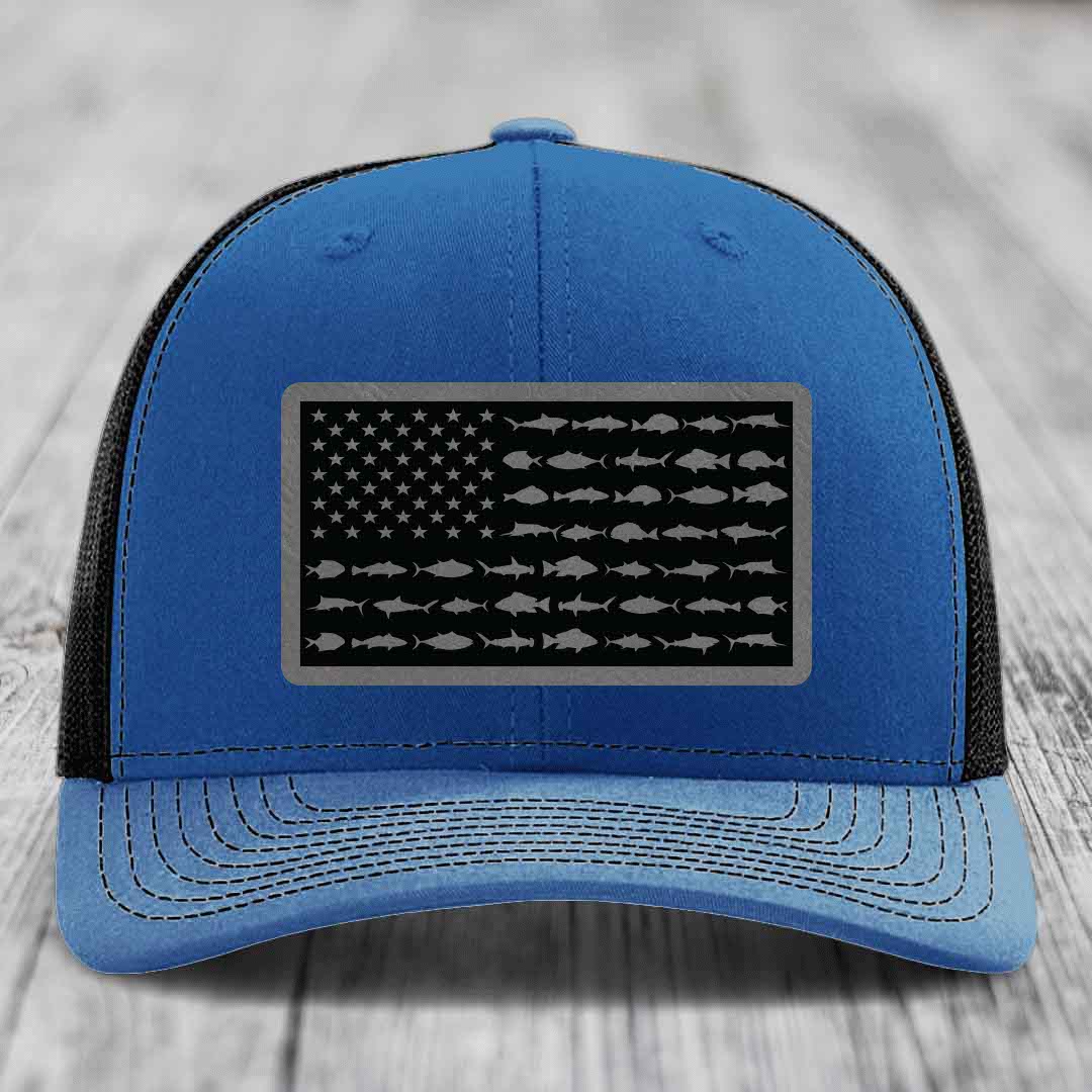 Blue trucker hat with American flag patch featuring fish silhouettes instead of stripes.