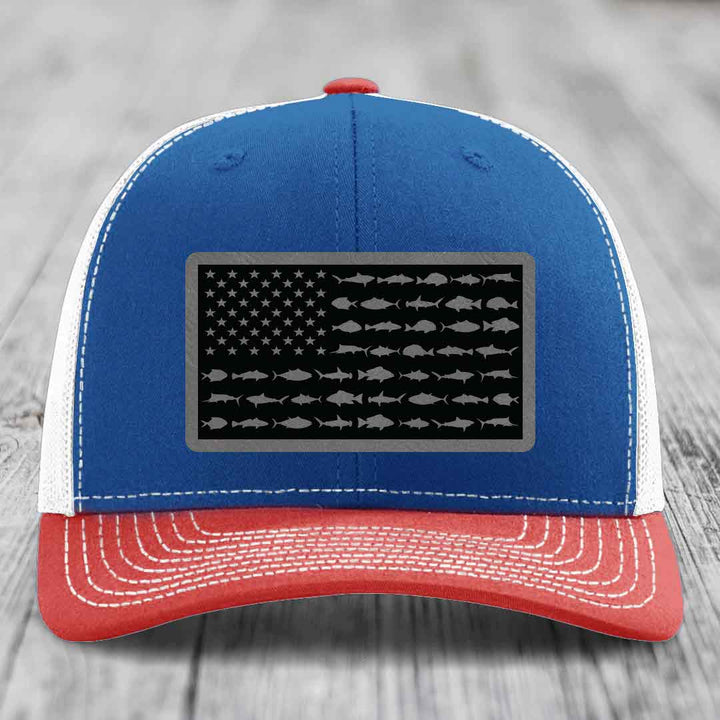 Blue and red trucker hat with American flag patch made of fish silhouettes.