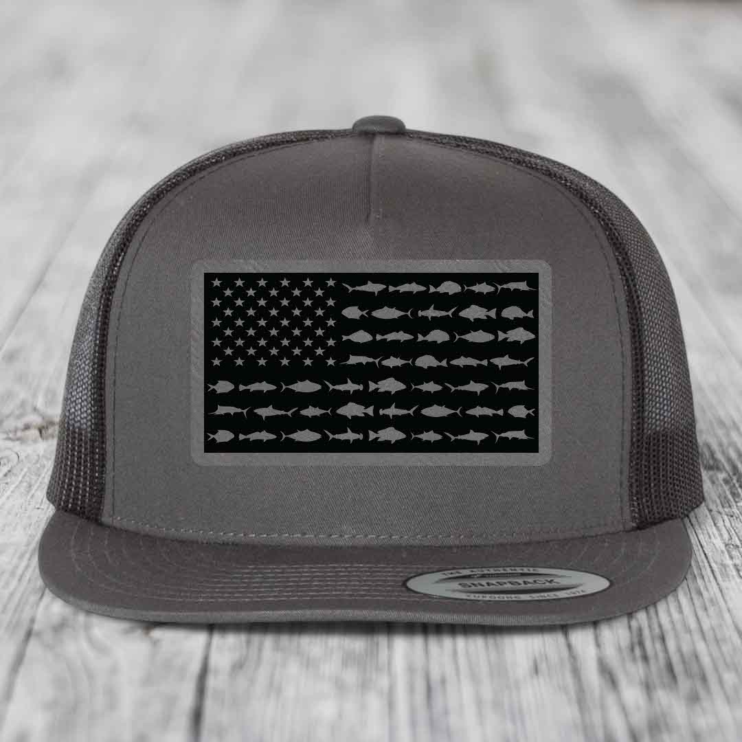 Grey trucker hat with American flag patch made of saltwater fish silhouettes.