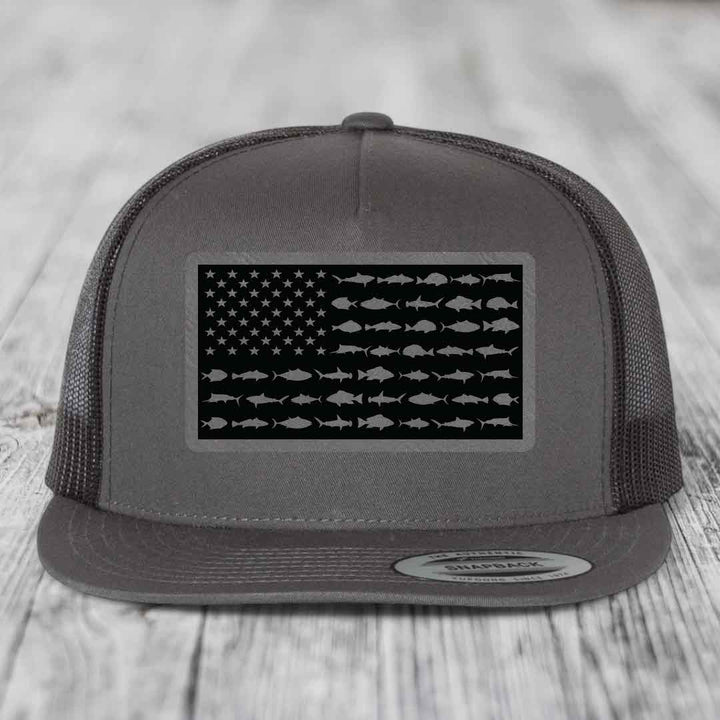 Grey trucker hat with American flag patch made of saltwater fish silhouettes.