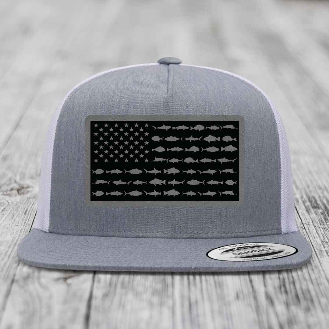 Grey trucker hat with black American flag patch featuring fish silhouettes instead of stars and stripes.