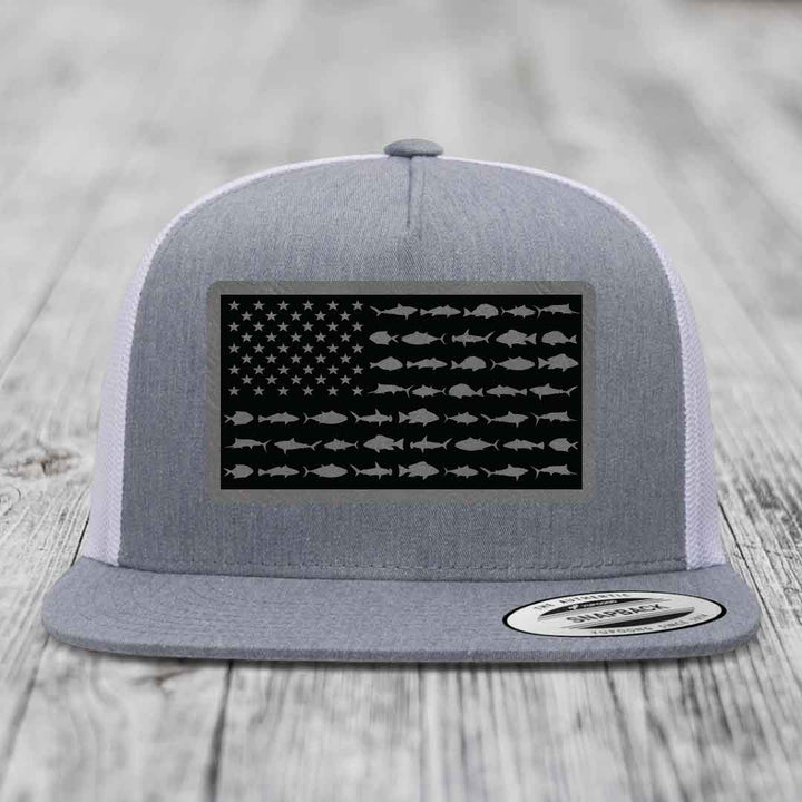 Grey trucker hat with black American flag patch featuring fish silhouettes instead of stars and stripes.