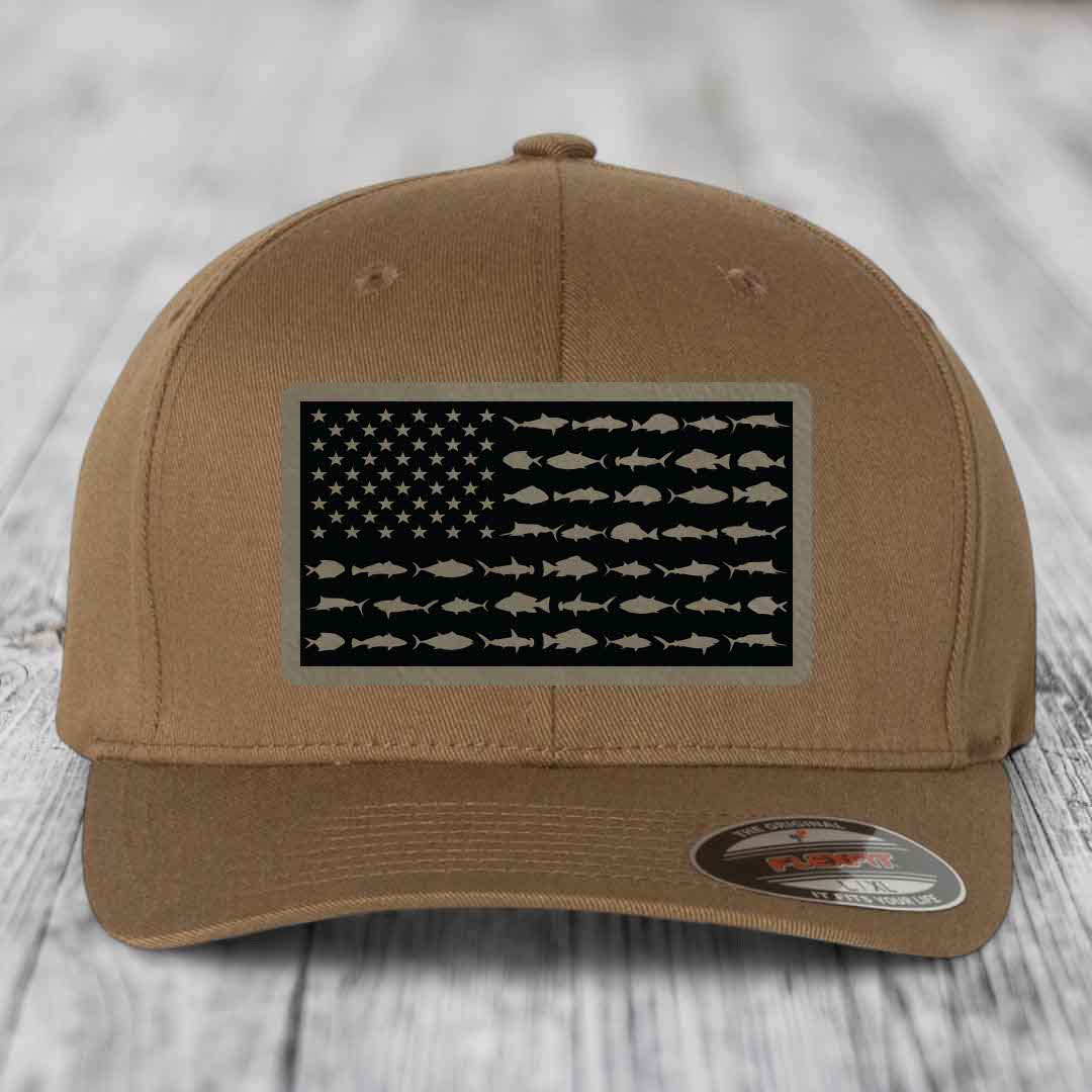 Tan baseball cap with American flag patch featuring fish silhouettes instead of stars and stripes.