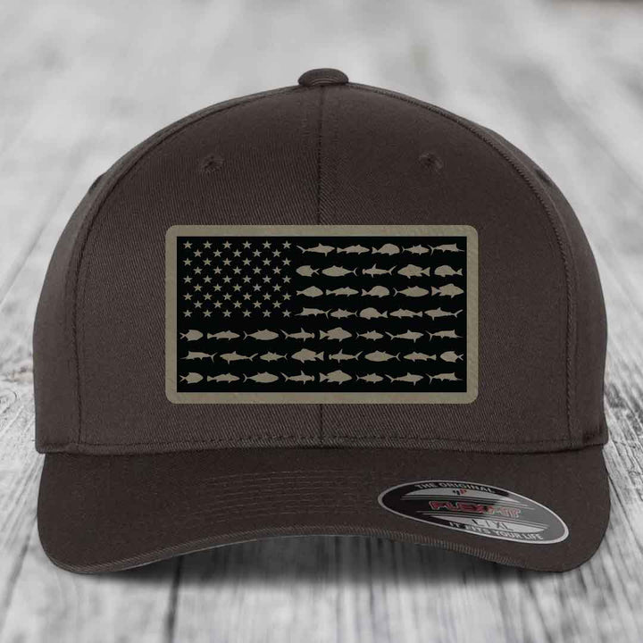 Brown baseball cap with American flag patch made of saltwater fish silhouettes.