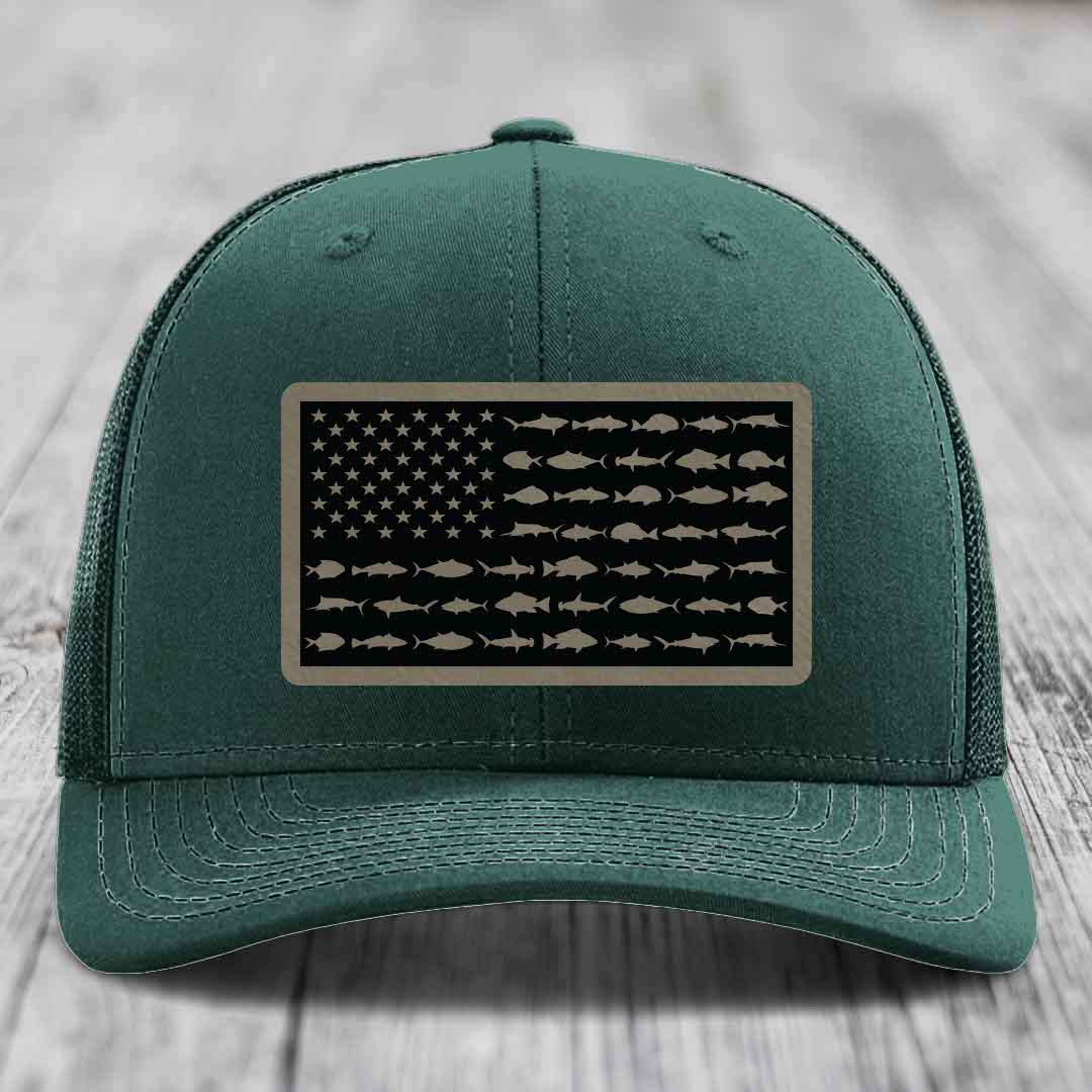 Green trucker hat with American flag patch made of saltwater fish silhouettes.
