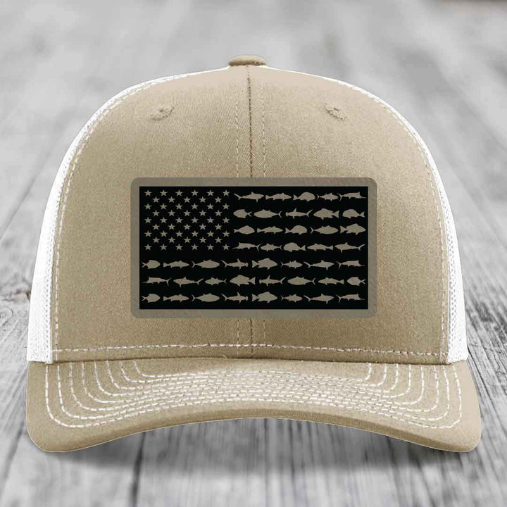 Tan trucker hat with American flag patch made of saltwater fish silhouettes.