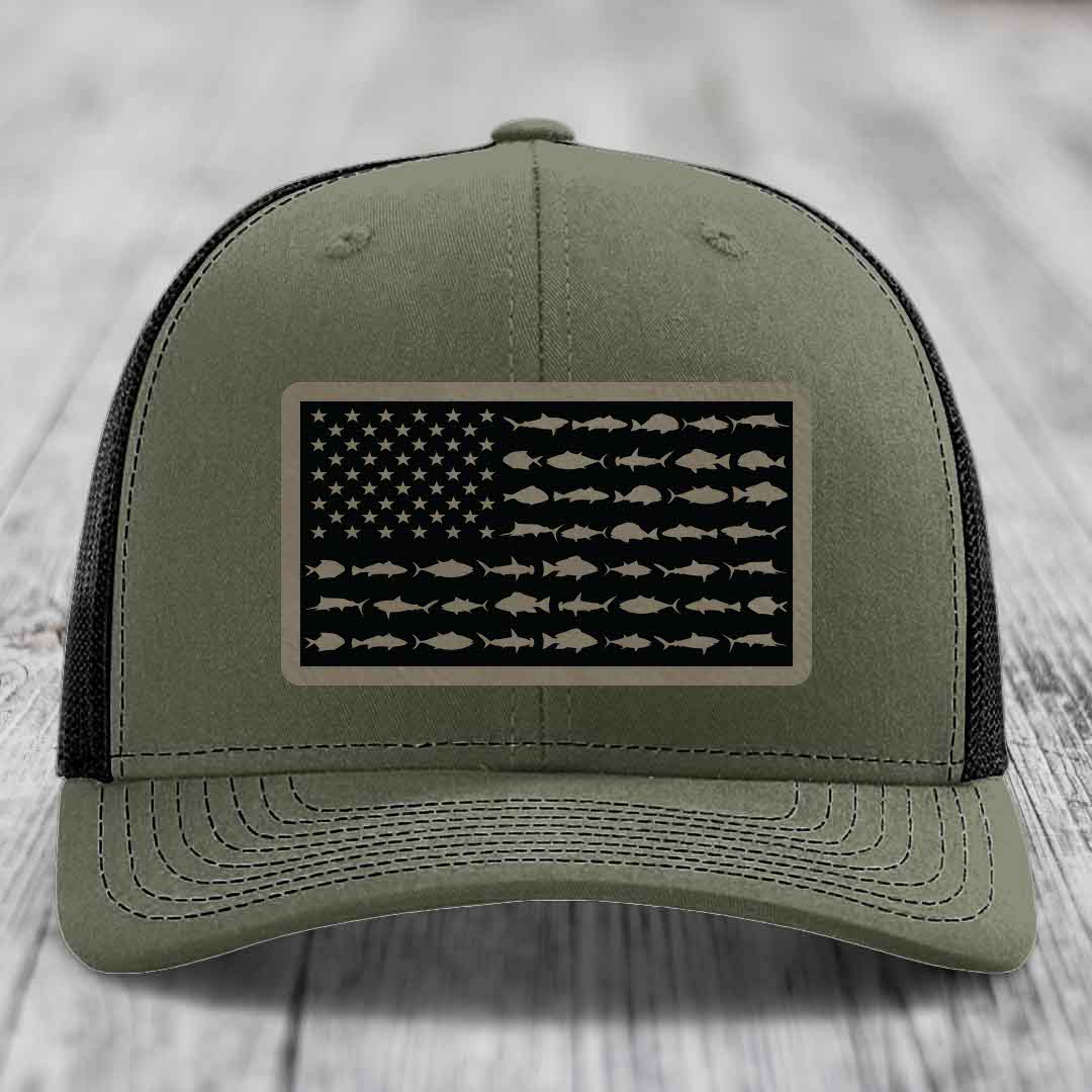 Olive green trucker hat with American flag patch made of saltwater fish silhouettes.