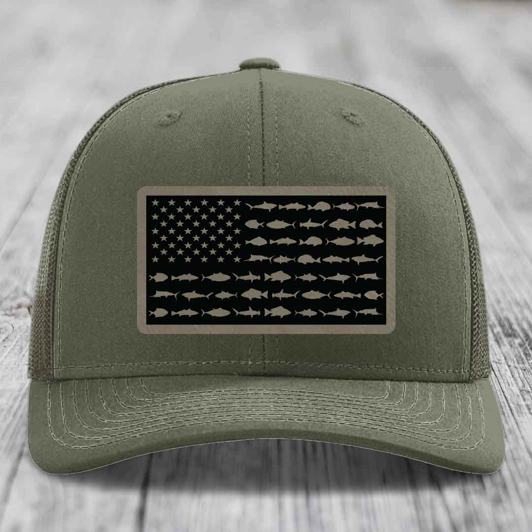 Olive green trucker hat with American flag patch made of saltwater fish silhouettes.