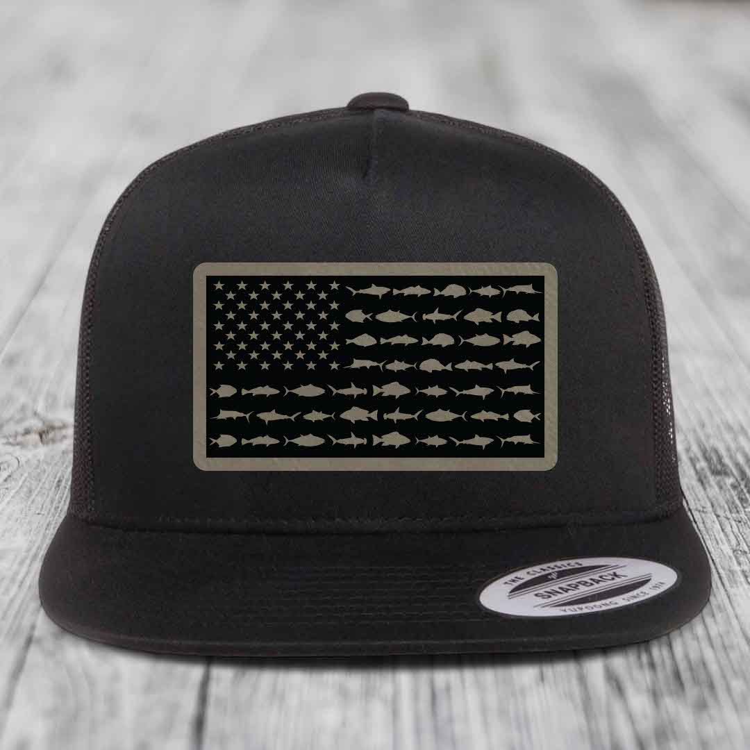 Black trucker hat with American flag patch made of saltwater fish silhouettes.