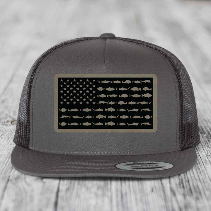 Grey trucker hat with American flag patch made of fish silhouettes.