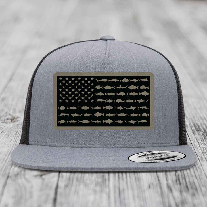 Grey trucker hat with American flag patch made of saltwater fish silhouettes.