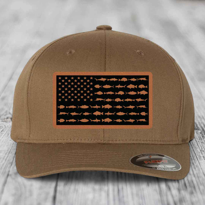 Tan baseball cap with American flag patch featuring fish silhouettes instead of stars and stripes.