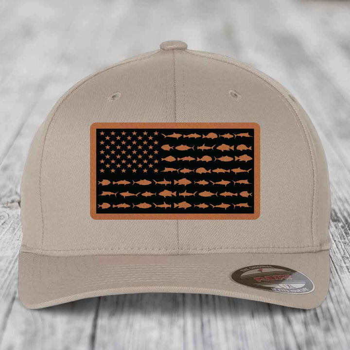 Beige baseball cap with American flag patch featuring fish silhouettes instead of stars and stripes.