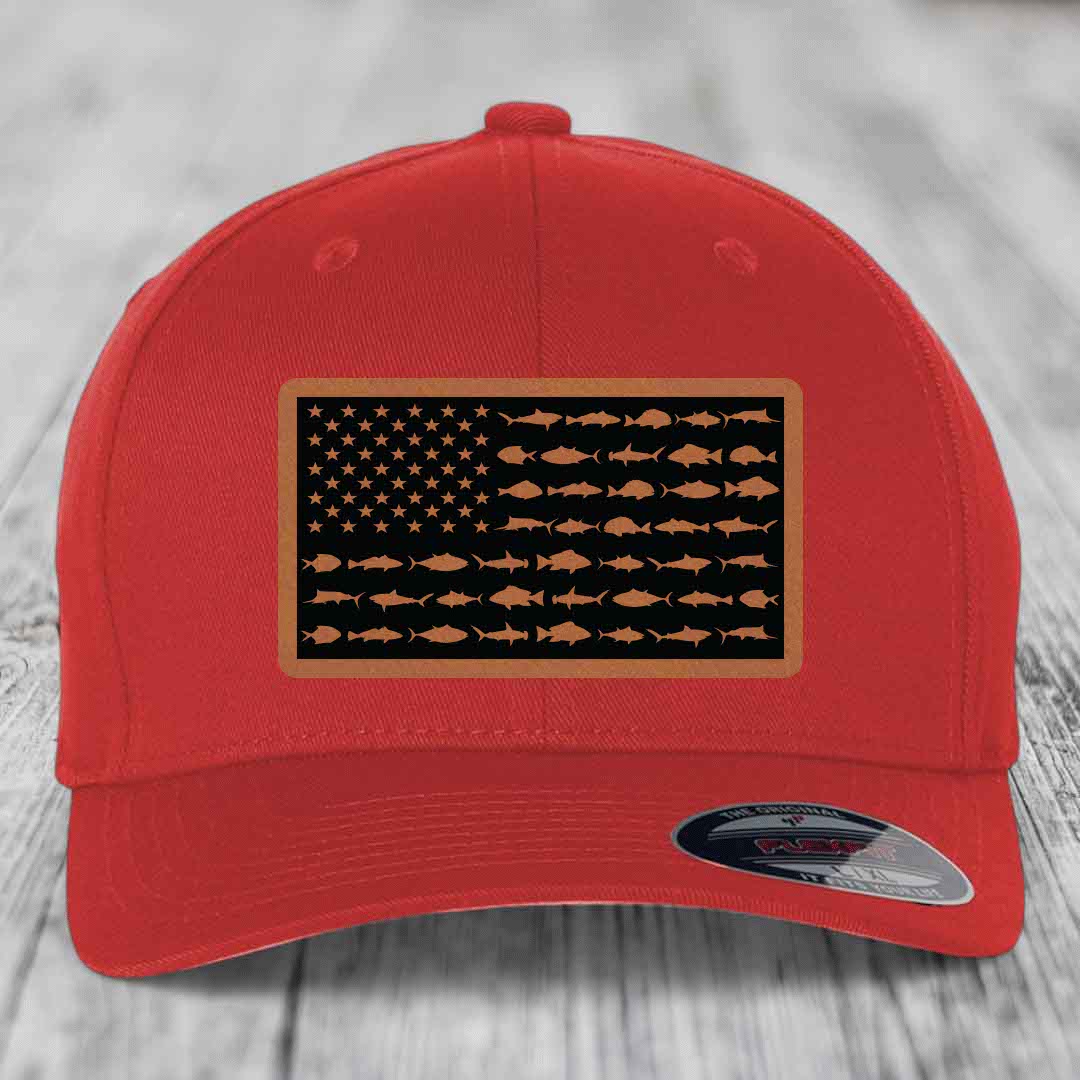 Red baseball cap with American flag patch featuring fish silhouettes instead of stars and stripes.